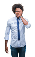 Sticker - Afro american business man wearing glasses over isolated background covering one eye with hand with confident smile on face and surprise emotion.