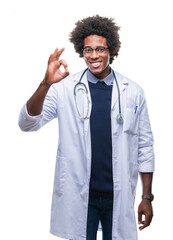 Sticker - Afro american doctor man over isolated background smiling positive doing ok sign with hand and fingers. Successful expression.