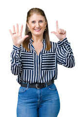 Sticker - Middle age mature business woman over isolated background showing and pointing up with fingers number seven while smiling confident and happy.