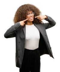 Sticker - African american business woman wearing glasses smiling confident showing and pointing with fingers teeth and mouth. Health concept.