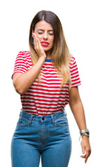 Canvas Print - Young beautiful woman casual look over isolated background touching mouth with hand with painful expression because of toothache or dental illness on teeth. Dentist concept.