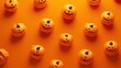 © Narongsag - Halloween Pumpkins on Orange Background.