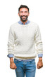 © Krakenimages.com - Adult hispanic man wearing winter sweater over isolated background with a happy and cool smile on face. Lucky person.