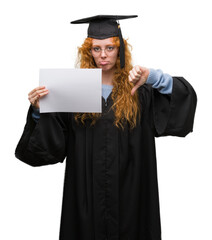 Sticker - Young redhead woman wearing graduate uniform holding degree with angry face, negative sign showing dislike with thumbs down, rejection concept