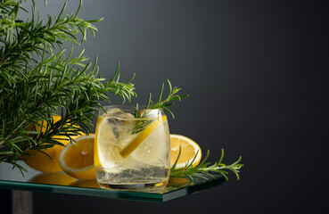 Poster - Refreshing drink with ice, lemon slices, and rosemary.