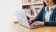 © Rahmat  - Close up hand of high school student woman studying,learning online academic lesson in  university library using the laptop computer, concept of education.