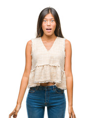 Canvas Print - Young asian woman over isolated background afraid and shocked with surprise expression, fear and excited face.