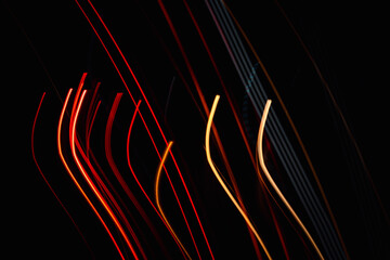 Wall Mural - the image is a black and white photo of a car with red and yellow streaks. the streaks are in the fo