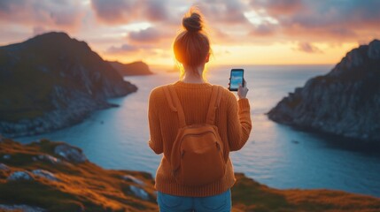 Poster - A woman stands on a hilltop, capturing the breathtaking sunset over the serene coastal waters, immersed in nature’s tranquility