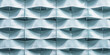 © xartproduction - Abstract closeup of a modern architectural facade showcasing wavy patterns and smooth textures