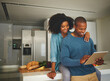 © StarDweller/peopleimages.com - Black couple, happy and tablet in kitchen with love, hug and reading website for dinner recipe. Man, woman and tech at home for social media, viral food hack and support in relationship for bonding