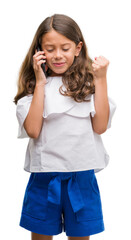 Poster - Brunette hispanic girl using smartphone screaming proud and celebrating victory and success very excited, cheering emotion