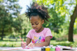 © Lazy_Bear - Focused little black girl painting outdoors on summer day. Educational activities for child in nature