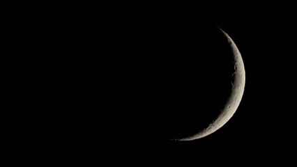 Wall Mural - waxing crescent moon seen with telescope
