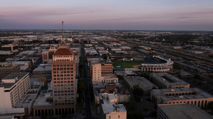 Wall Mural - Fresno, California, USA - April 18, 2023: Sunset light shines on the historic downtown Fresno skyline.