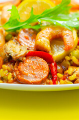 Wall Mural - A plate of food with shrimp, peppers, and rice