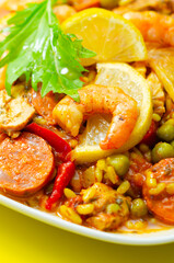 Wall Mural - A plate of food with shrimp, peppers, and rice