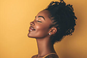 A close up of a tattooed black woman's face with her eyes closed