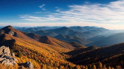 Wall Mural - Majestic autumn view of mountains under a vast blue sky 