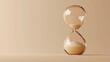 © Flowaiart - A sand timer is sitting on a tan surface