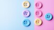 © Murda - Colorful buttons on blue and pink background.