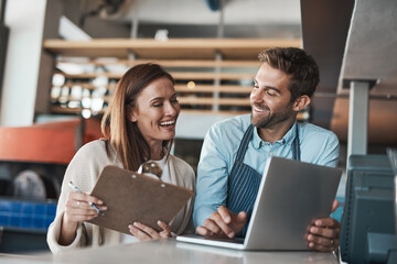 Fototapete - Small business, happy and couple in cafe with laptop, positive review and pride for turnover report. Restaurant owners, smile and computer at counter for information, banking and success in startup