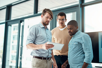 Wall Mural - Tablet, business men and planning for meeting with app developer project with design ideas in office. Brainstorming, tech and teamwork of employee with digital collaboration for homepage layout talk