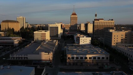 Wall Mural - Fresno, California, USA - April 18, 2023: Sunset light shines on the historic downtown Fresno skyline.