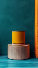 Wall Mural - A yellow and brown coffee cup sits on a wooden pedestal in front of a blue wall