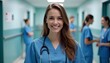 © tinybrushcreations - A young Caucasian woman with long brown hair wearing a blue medical scrubs and a stethoscope, smiling in a hospital hallway