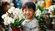 © Geekminds - child and orchid, kid with orchid plant, orchid child, youth tending to orchid, new generation, next generation, minor orchid hobbyist, youngster orchid grower, child orchid caretaker