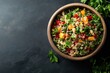 © Call Me Photo - Vibrant quinoa salad with mixed vegetables and tangy dressing, placed on the right side of a dark stone table. Professional overhead shot highlighting the fresh and colorful dish.