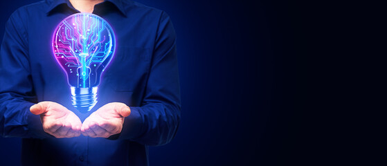 Poster - Male hands holding illuminated circuit lightbulb symbolizing tech innovation on dark blue background.