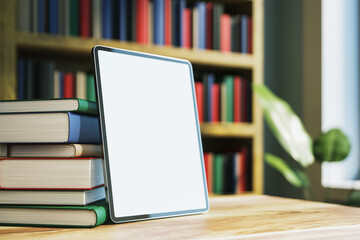 Canvas Print - Tablet and books on a desk in a library with a blurred background. 3D Rendering