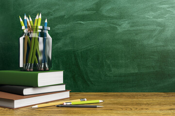 Poster - Back to school stationery on desk with green chalkboard background. 3D Rendering