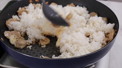 Wall Mural - Stir Fry Nasi Goreng, White Rice toasted with Garlic, Shallots, and Various Spice