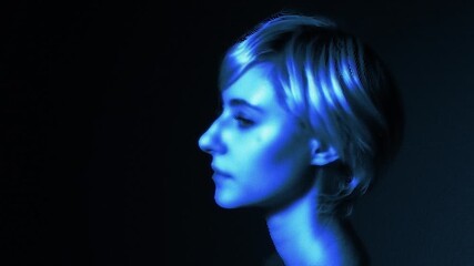 Poster - A woman's face expressed with a digital dot pattern