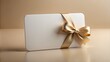 © Man888 - A blank white gift card with a shiny finish and a subtle texture, lying on a soft, neutral-colored background, ready for customization.