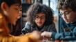 © irissca - Group of diverse children playing board game together, focused and engaged, in a cozy indoor setting.
