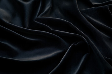 a black fabric with a pattern of swirls