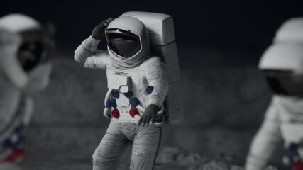 Canvas Print - Three astronauts dance happily on the moon