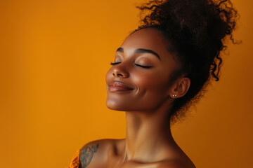 A close up of a tattooed black woman's face with her eyes closed