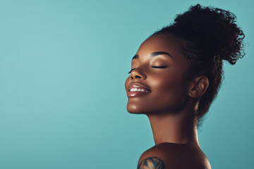 A close up of a tattooed black woman's face with her eyes closed