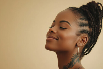 A close up of a tattooed black woman's face with her eyes closed