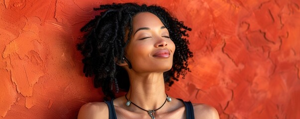 Sticker - A content woman rests after a workout against a red wall 