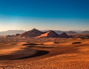 Wall Mural - Mountains tower in the distance, casting long shadows across a vast, barren desert landscape.