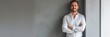 © AlfaSmart - Man standing confidently against a plain grey background