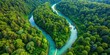 © Vibrant Visions Pixe - Aerial view of a road winding through a lush green forest alongside a tranquil blue river, aerial view, road, forest, trees, green