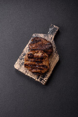 Fresh juicy delicious beef steak on a dark background