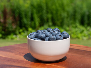 Wall Mural - Ripe sweet organic blueberry in the bowl